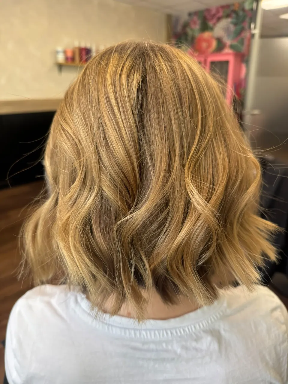 Textured bob with golden balayage and loose waves